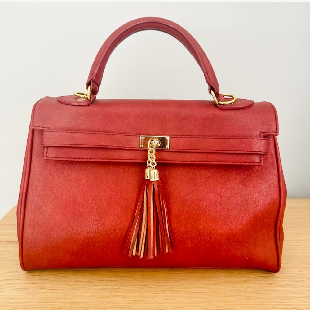 Red in style of Hermes “Kelly” handbag